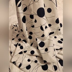 Polyester lightweight Cream & Black abstract fabric